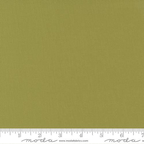 Cotton quilting fabric pattern called 'Fig Tree Olive'. Part of the 'Bella Solids' fabric collection. Designed by Moda for fabric company Moda. SKU: 9900 69. 44-45 inch width.