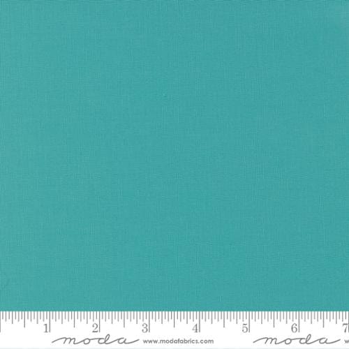 Cotton quilting fabric pattern called 'Caribbean'. Part of the 'Bella Solids' fabric collection. Designed by Moda Fabrics for fabric company Moda Fabrics. SKU: 9900 211. 44-45 inch width.