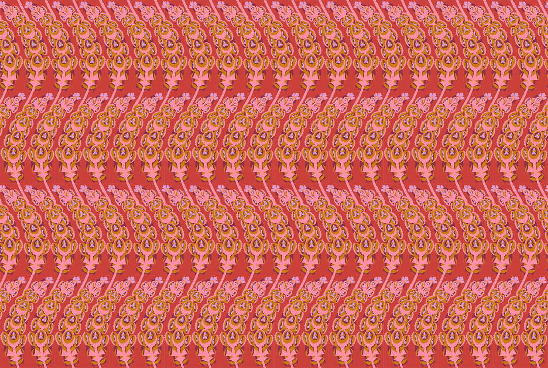 A closeup shot of the quilting fabric pattern called Bells of Ireland, designed by Anna Maria Horner, in the coral colorway. The SKU is AMT133-38V.