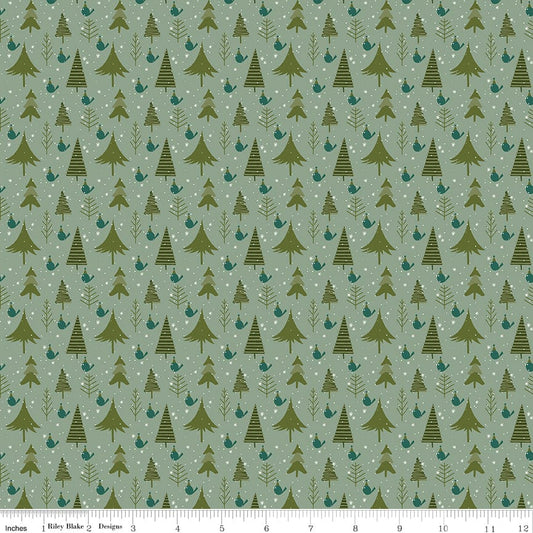 Cotton quilting fabric pattern called 'Trees in Sage'. Part of the 'Christmas is in Town' fabric collection. Designed by Sandy Gervais for fabric company Riley Blake. SKU: C14744-SAGE. 44-45 inch width.