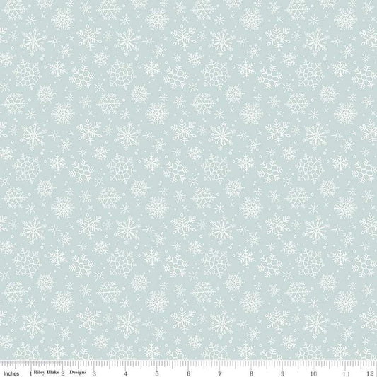 Cotton quilting fabric pattern called 'Snowflake in Blue'. Part of the 'Magical Winterland' fabric collection. Designed by Lisa Audit for fabric company Riley Blake. SKU: C14944-BLUE. 44-45 inch width.