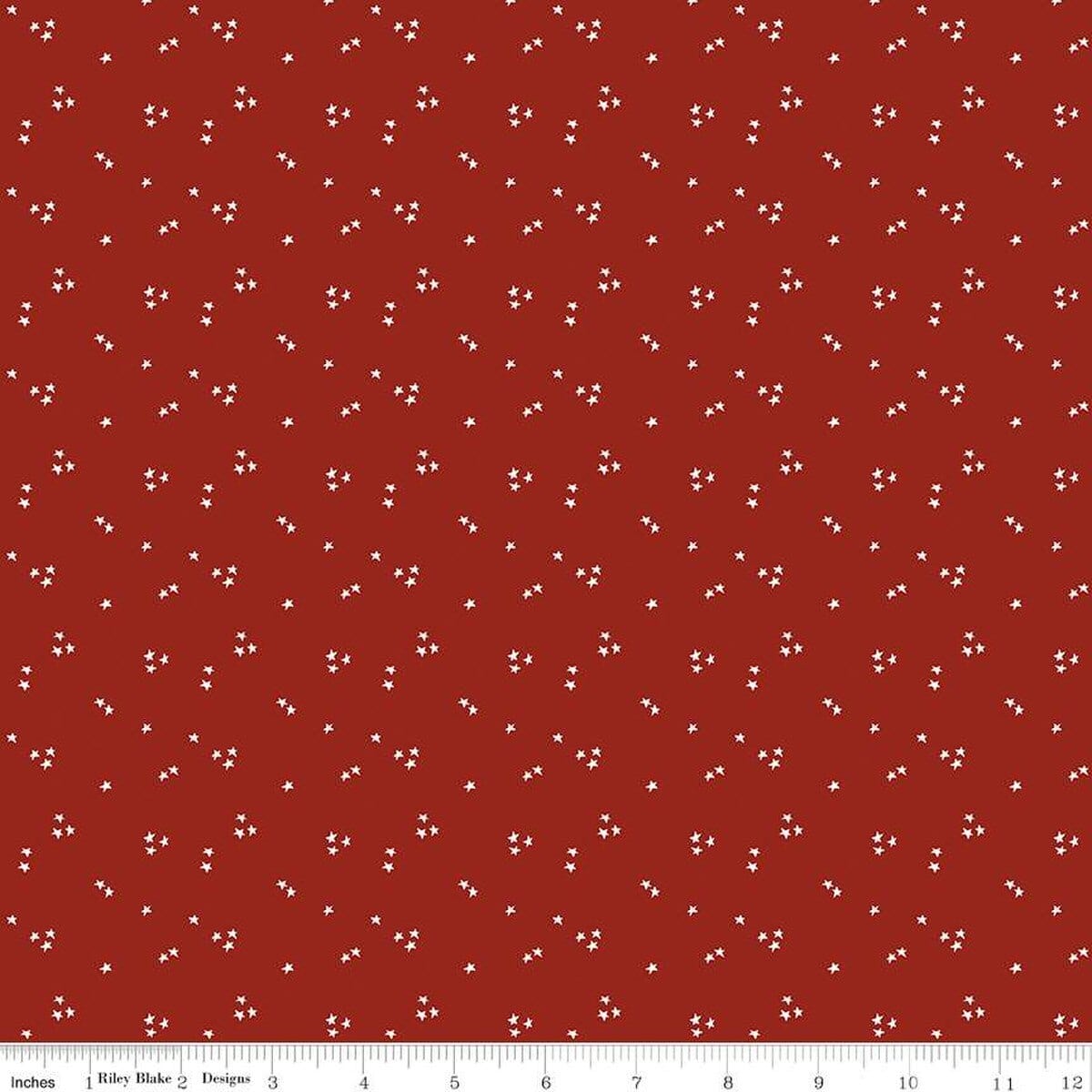 A closeup shot of the quilting fabric pattern called Shining Star, designed by Jennifer Long for Riley Blake, in the fire truck red colorway. The SKU is C15466-FIRETRUCK.