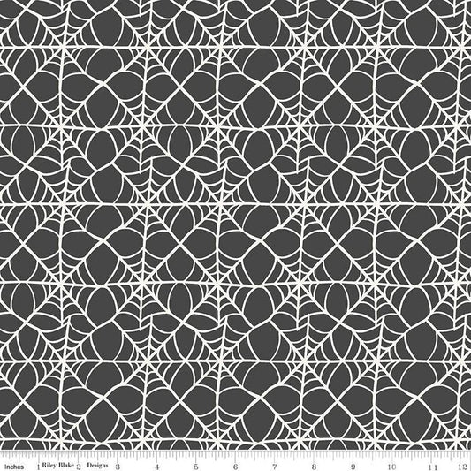 A closeup shot of the quilting fabric pattern called Webs, designed by My Mind's Eye for Riley Blake, in the charcoal colorway. The SKU is C16033-CHARCOAL.