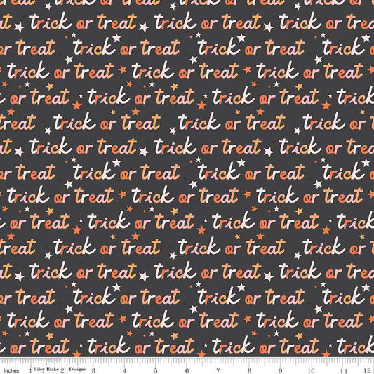A closeup shot of the quilting fabric pattern called Trick or Treat, designed by My Mind's Eye for Riley Blake, in the charcoal colorway. The SKU is C16034-CHARCOAL.