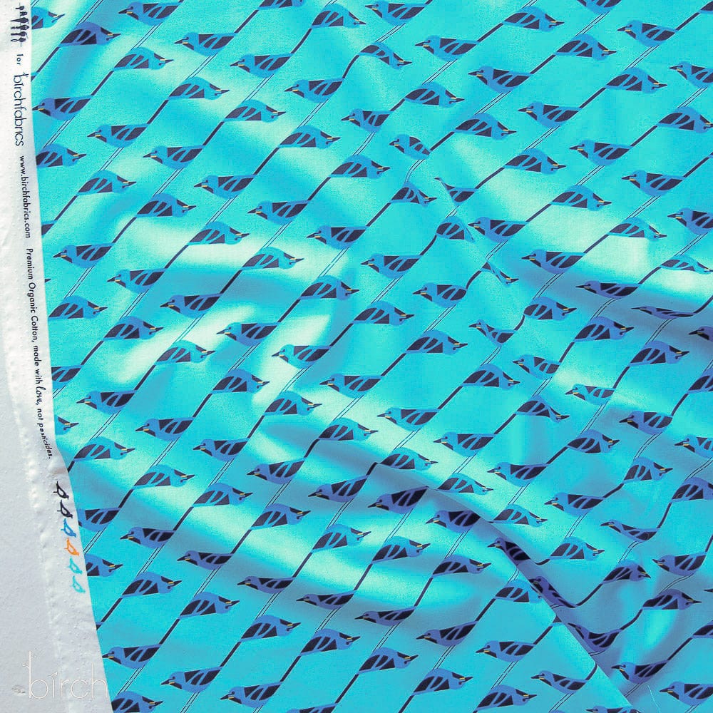 Cotton quilting fabric pattern called 'Bluebird Stagger'. Part of the 'Monteverde Habitat Vol. 1' fabric collection. Designed by Charlie Harper for fabric company Birch Fabrics. SKU: CH-371. 44-45 inch width.