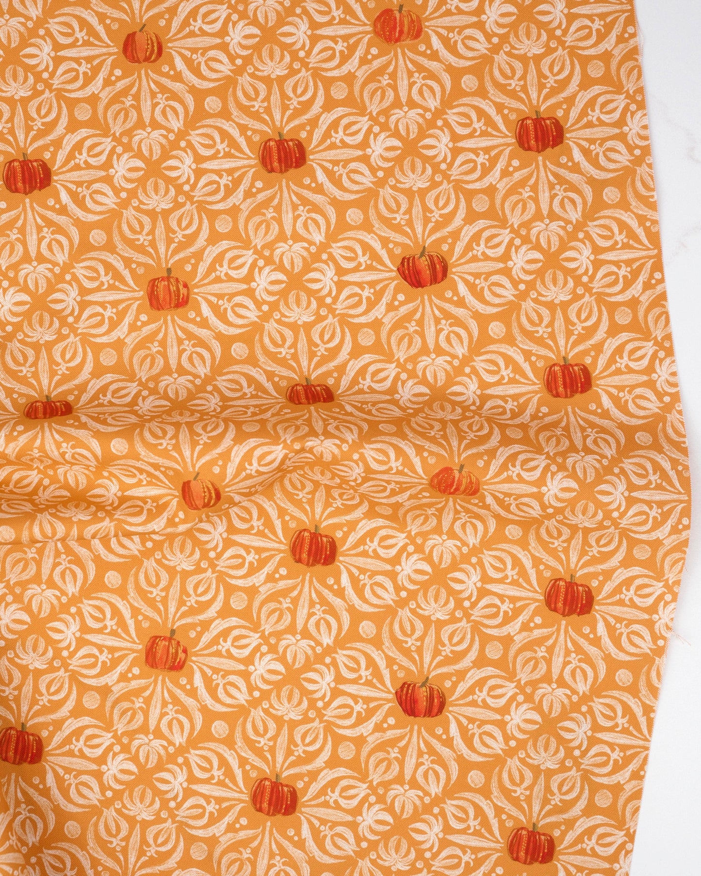 Medallion Tiles Damask Pumpkin quilting fabric, part of the Coven fabric collection by Robin Pickens (SKU: 48802 12)