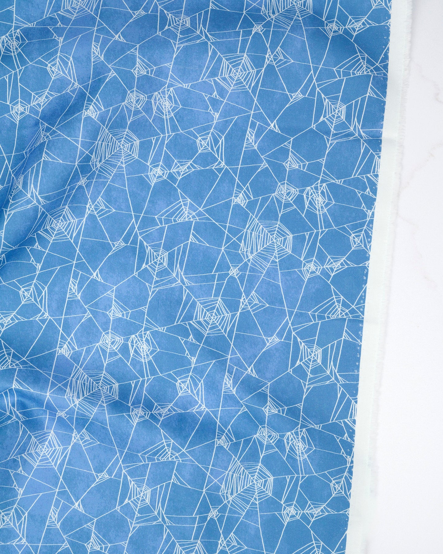 Spider Web Halloween Dusk quilting fabric, part of the Coven fabric collection by Robin Pickens (SKU: 44804 14)