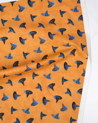 Witch Hats Pumpkin quilting fabric, part of the Coven fabric collection by Robin Pickens (SKU: 48805 12)