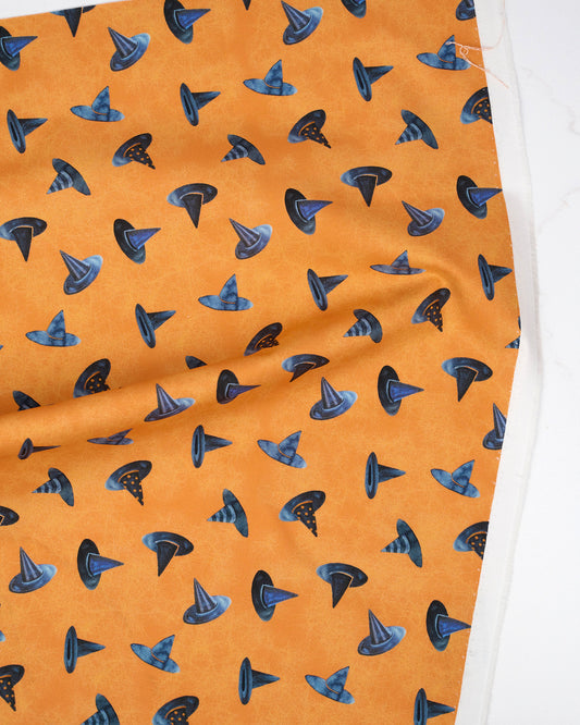 Witch Hats Pumpkin quilting fabric, part of the Coven fabric collection by Robin Pickens (SKU: 48805 12)