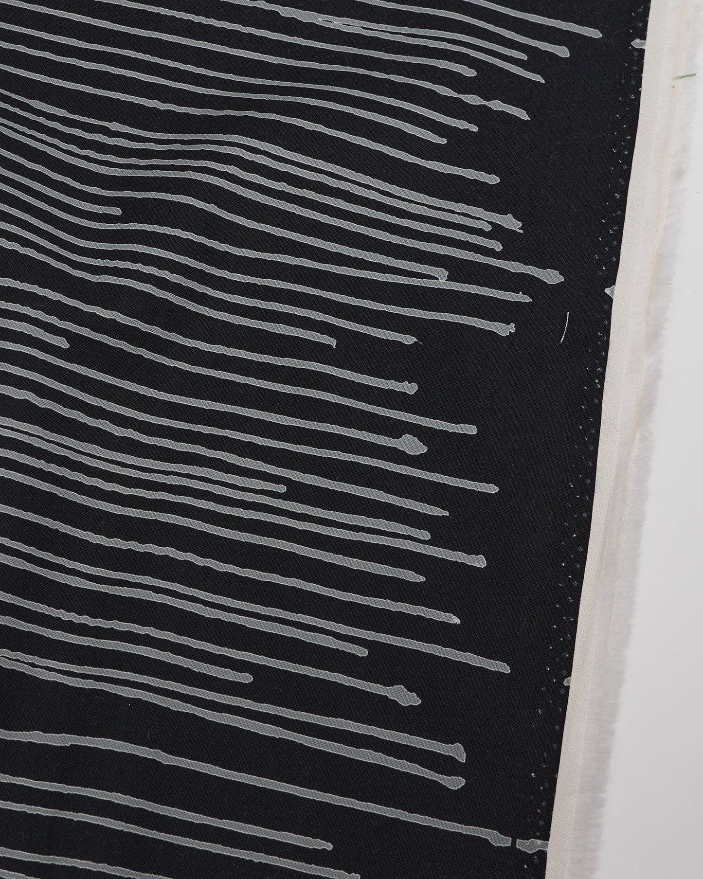 Cotton quilting fabric pattern called 'Drip in Zebra'. Part of the 'Ink by Giucy Giuce' fabric collection. Designed by Giucy Giuce for fabric company Andover Fabrics. SKU: A-911-K. 44-45 inch width.