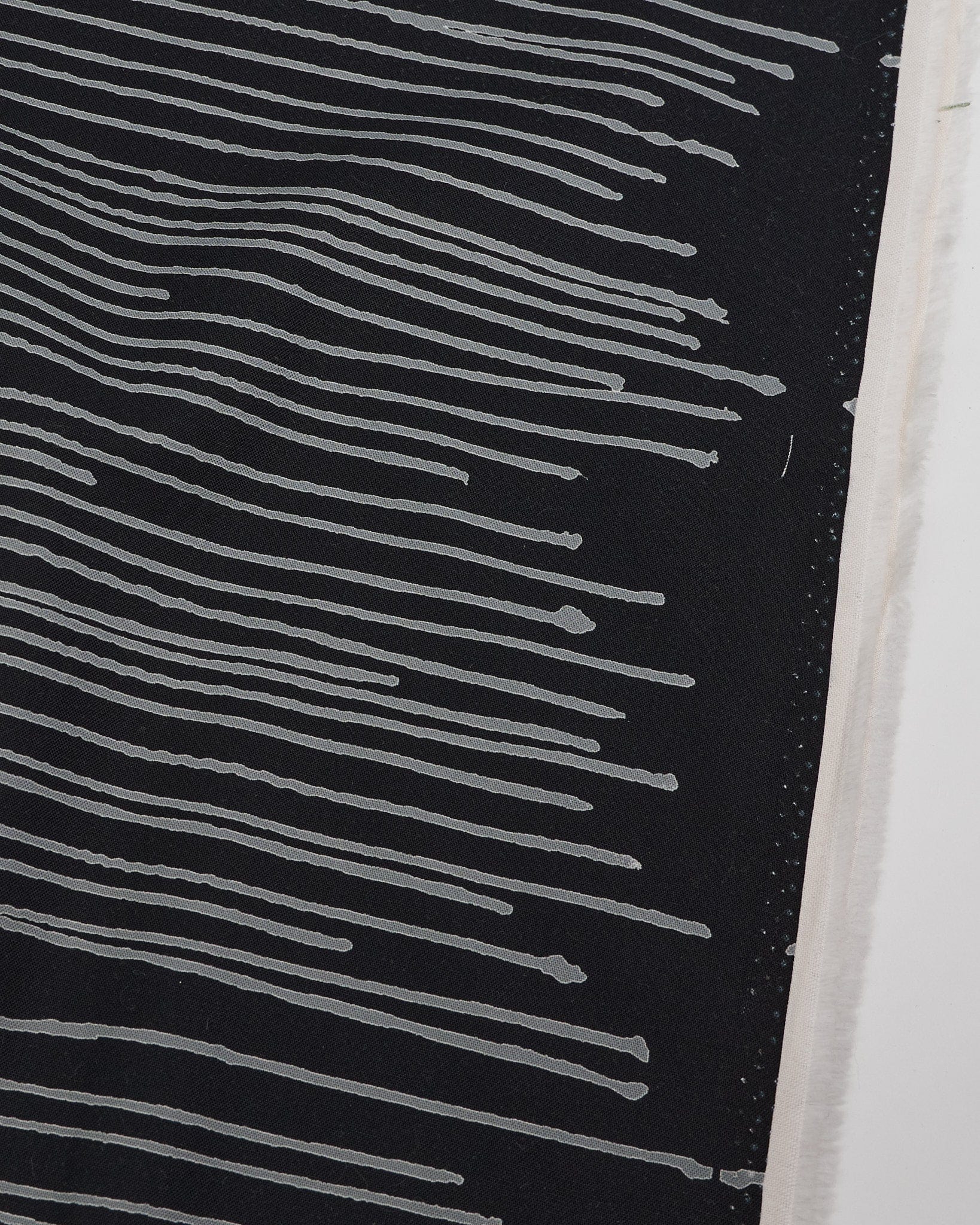 Cotton quilting fabric pattern called 'Drip in Zebra'. Part of the 'Ink by Giucy Giuce' fabric collection. Designed by Giucy Giuce for fabric company Andover Fabrics. SKU: A-911-K. 44-45 inch width.