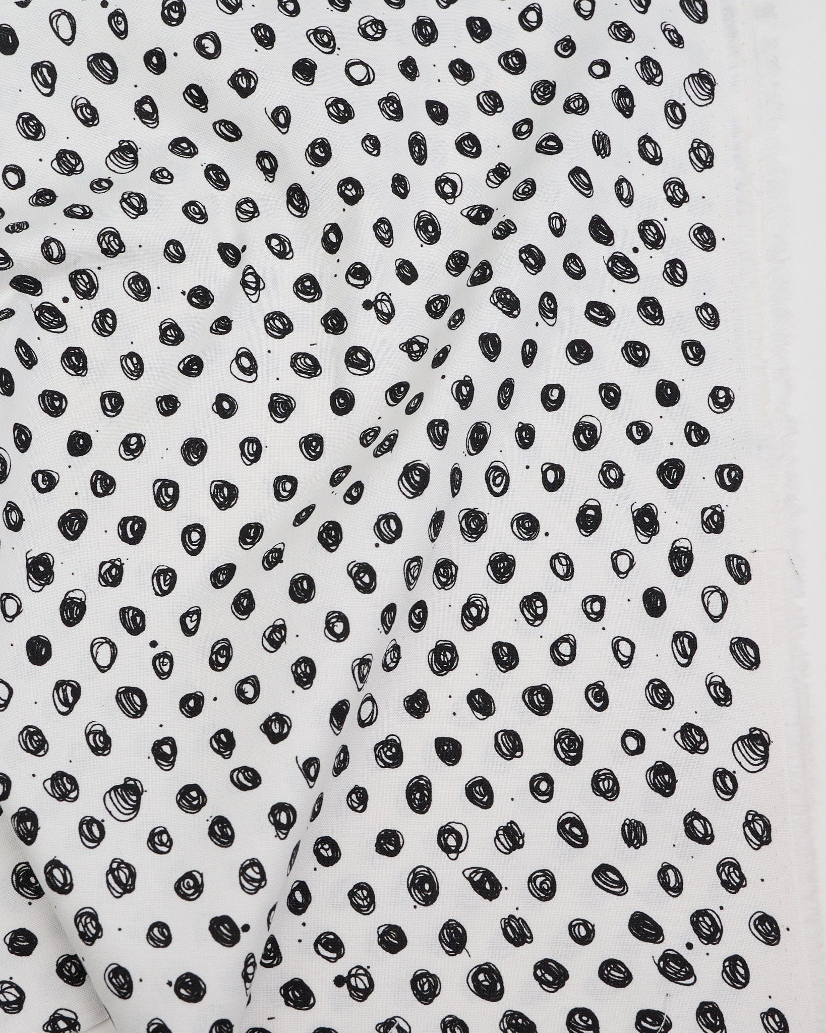 Cotton quilting fabric pattern called 'Polka in Snowy Owl'. Part of the 'Ink by Giucy Giuce' fabric collection. Designed by Giucy Giuce for fabric company Andover Fabrics. SKU: A-915-K. 44-45 inch width.