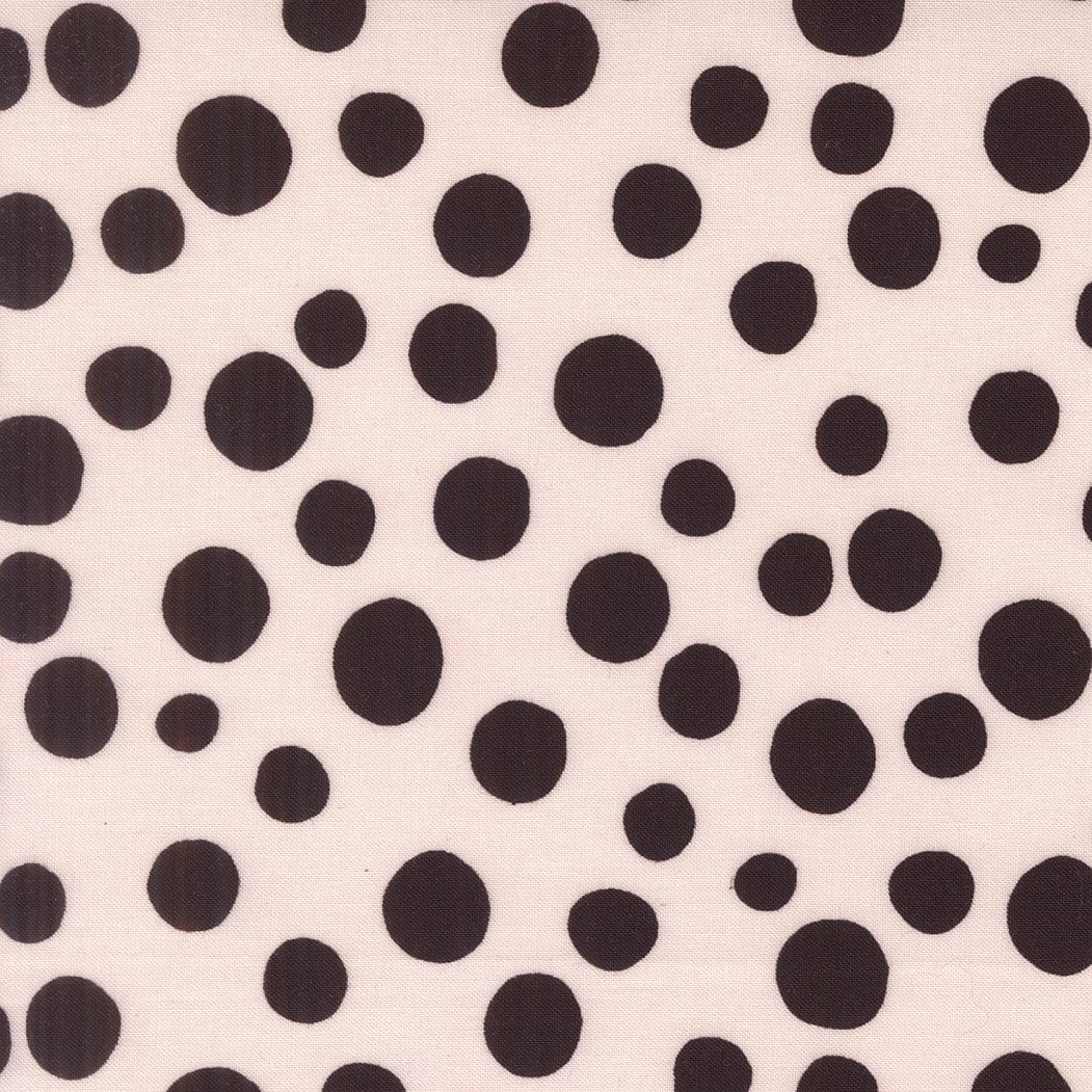 A closeup shot of the quilting fabric pattern called Big Dot, designed by Lizzy House, in the champagne colorway. The SKU is 37145 12.