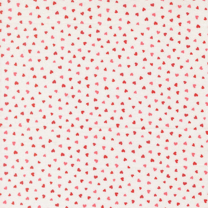 A closeup shot of the quilting fabric pattern called Tiny Hearts, designed by Lizzy House, in the champagne colorway. The SKU is 37148 11.