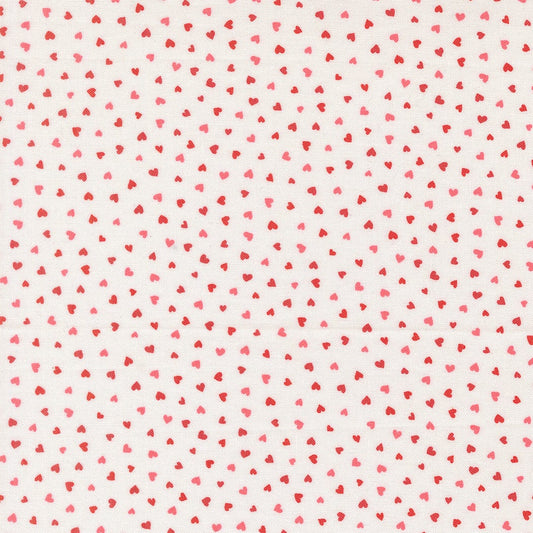 A closeup shot of the quilting fabric pattern called Tiny Hearts, designed by Lizzy House, in the champagne colorway. The SKU is 37148 11.