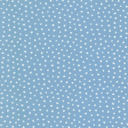 A closeup shot of the quilting fabric pattern called Tiny Hearts, designed by Lizzy House, in the sky colorway. The SKU is 37148 25.