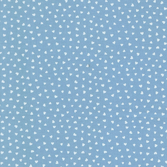 A closeup shot of the quilting fabric pattern called Tiny Hearts, designed by Lizzy House, in the sky colorway. The SKU is 37148 25.