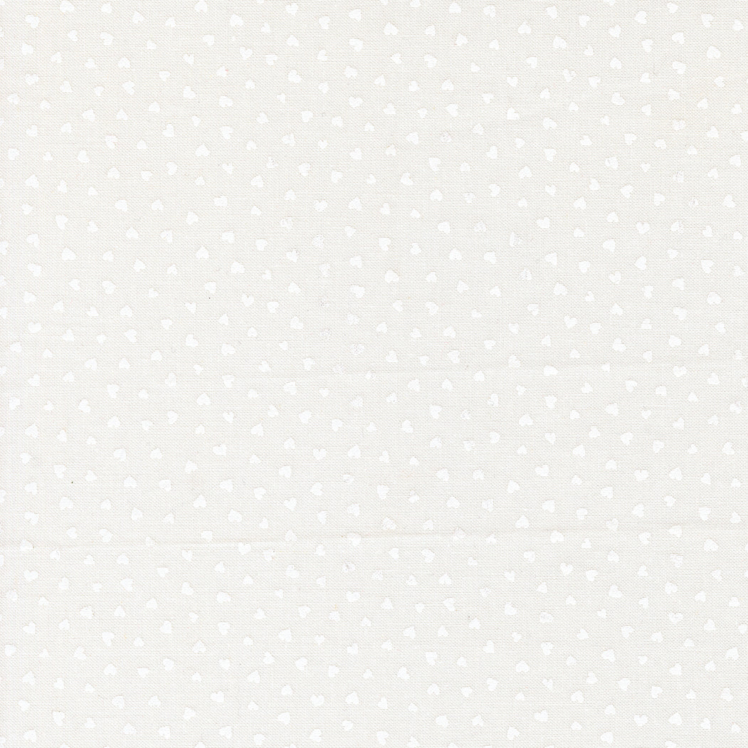A closeup shot of the quilting fabric pattern called Tiny Hearts, designed by Lizzy House, in the champagne-white colorway. The SKU is 37148 31.
