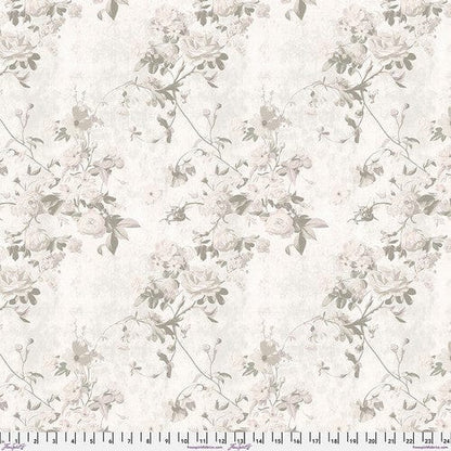 A piece of cotton fabric with a floral pattern in varying shades of gray and white, labeled with the brand Free Spirit Fabrics and the collection name Enrapture.