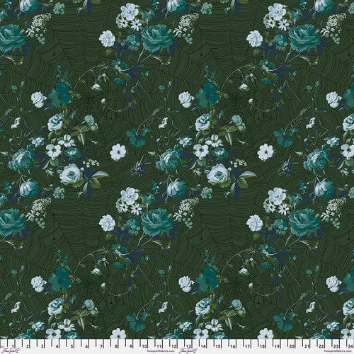 A piece of verdant green fabric with a floral pattern designed by Giucy Giuce for Free Spirit Fabrics, part of the Enrapture collection.