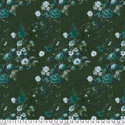 A piece of verdant green fabric with a floral pattern designed by Giucy Giuce for Free Spirit Fabrics, part of the Enrapture collection.
