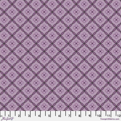 A quilt fabric with a geometric tile pattern in amethyst purple color.