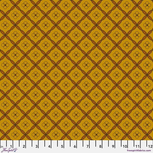 A swatch of fabric featuring a geometric tile pattern in various shades of orange and brown.