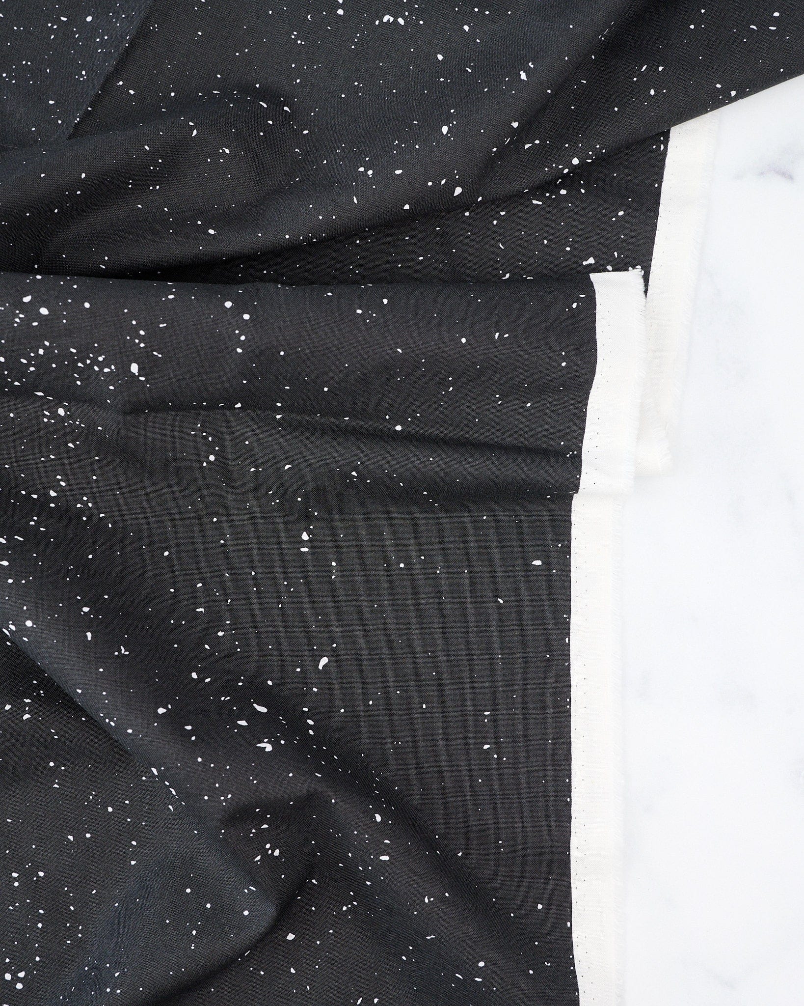 Particles in Onyx quilting fabric, part of the Enrapture fabric collection by Giucy Giuce (SKU: PWGG011.ONYX)