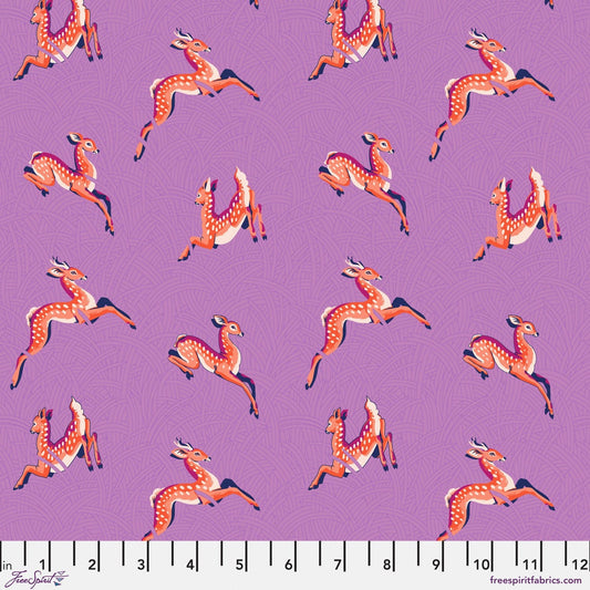 Cotton quilting fabric pattern called 'Wild Meadow in Lavender'. Part of the 'Mythical' fabric collection. Designed by Stacy Peterson for fabric company FreeSpirit Fabrics. SKU: PWST015.XLAVENDER. 44-45 inch width.