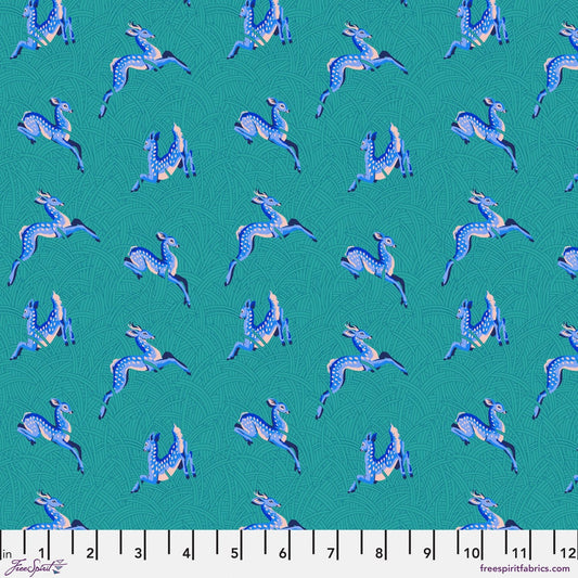 Cotton quilting fabric pattern called 'Small Wild Meadow in Teal'. Part of the 'Mythical' fabric collection. Designed by Stacy Peterson for fabric company FreeSpirit Fabrics. SKU: PWST016.XTEAL. 44-45 inch width.