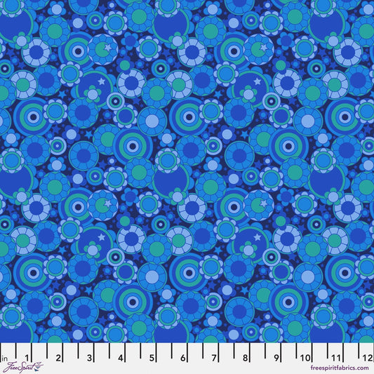 Cotton quilting fabric pattern called 'Mythical Bloom in Blue'. Part of the 'Mythical' fabric collection. Designed by Stacy Peterson for fabric company FreeSpirit Fabrics. SKU: PWST020.XBLUE. 44-45 inch width.