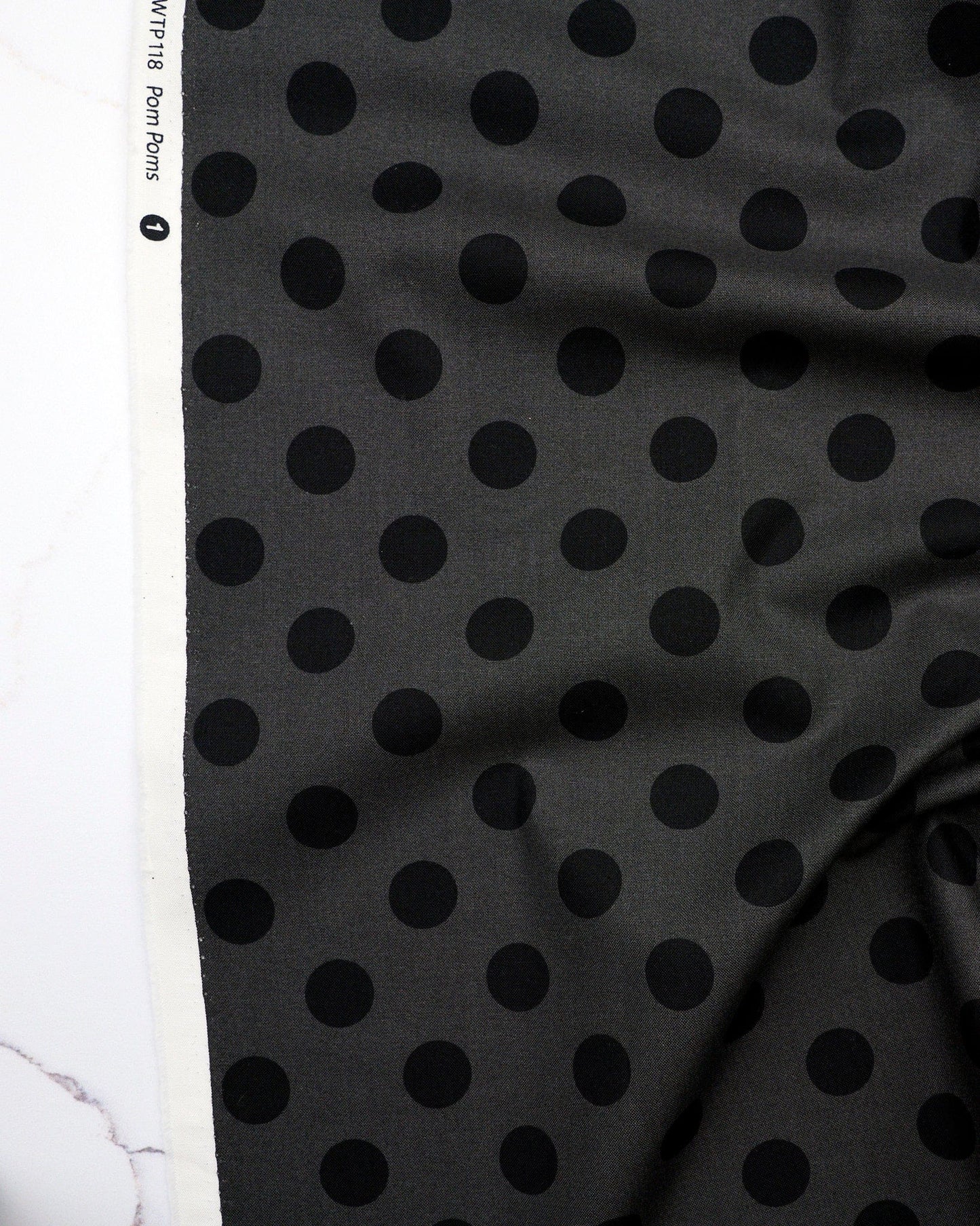 Pom Poms in Carbon quilting fabric, part of the Fall 2025 True Colors fabric collection by Tula Pink (SKU: PWTP118.CARBON)