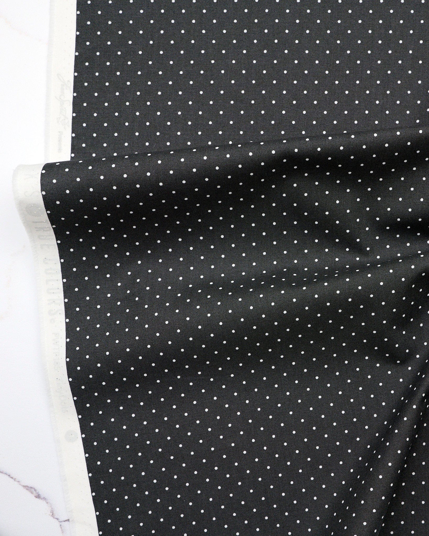 Tiny Dots in Carbon quilting fabric, part of the Fall 2025 True Colors fabric collection by Tula Pink (SKU: PWTP185.CARBON)