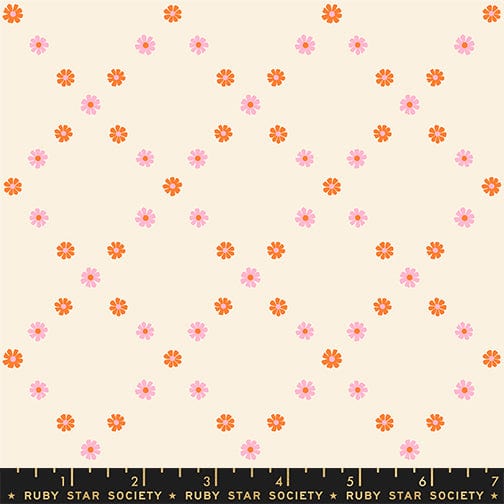 A closeup shot of the quilting fabric pattern called Diamond Flowers, designed by Melody Miller for Ruby Star Society, in the posy orange colorway. The SKU is RS0107 12.