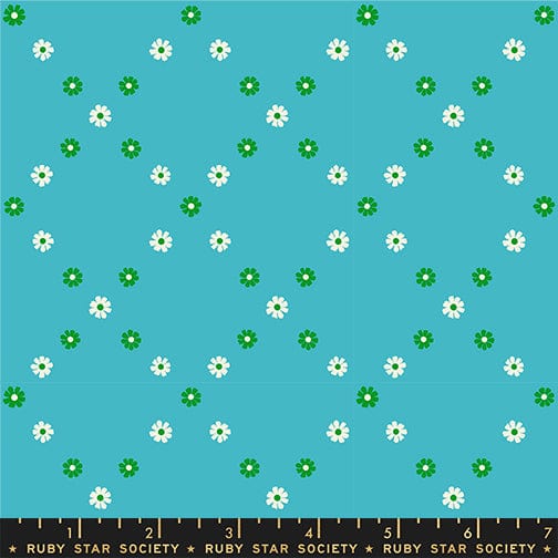 A closeup shot of the quilting fabric pattern called Diamond Flowers, designed by Melody Miller for Ruby Star Society, in the dark turquoise colorway. The SKU is RS0107 16.
