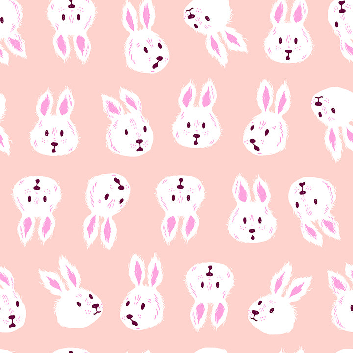 A closeup shot of the quilting fabric pattern called Rushing Rabbit, designed by Sarah Watts for Ruby Star Society, in the vintage pink colorway. The SKU is RS2125 11.