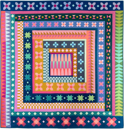 Ramble Block of the Month by Tara Faughnan. Colorful quilt with geometric patterns on a blue background