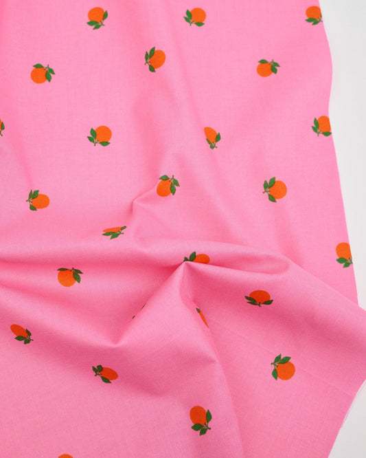 Cotton quilting fabric pattern called 'Tangerines in June'. Part of the 'Rise and Shine' fabric collection. Designed by Melody Miller of Ruby Star Society for fabric company Moda Fabrics. SKU: RS0082 14. 44-45 inch width.