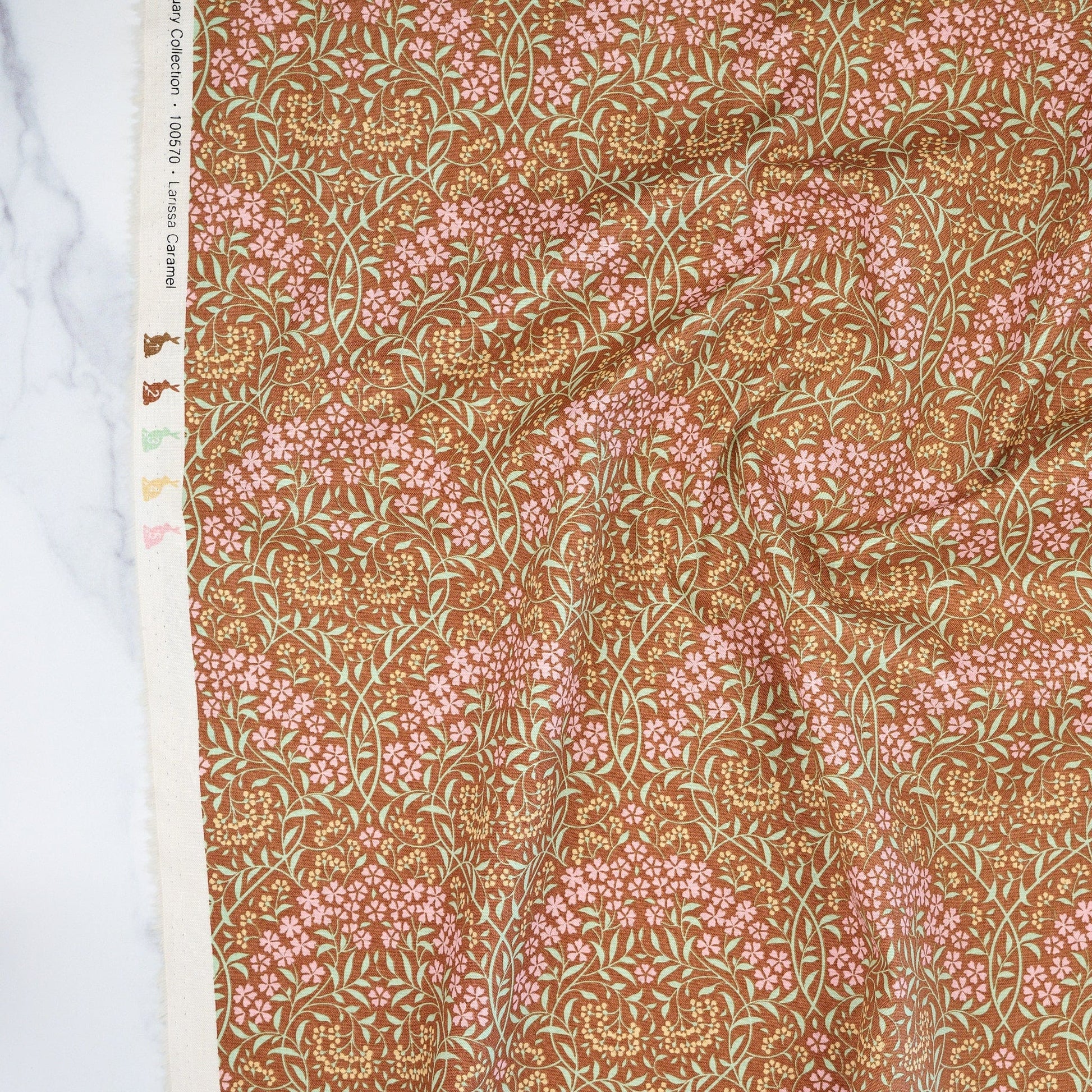 Cotton quilting fabric pattern called 'Larissa Caramel'. Part of the 'Sanctuary' fabric collection. Designed by Tone Finnanger for fabric company Tilda Fabrics. SKU: TIL100570. 44-45 inch width.