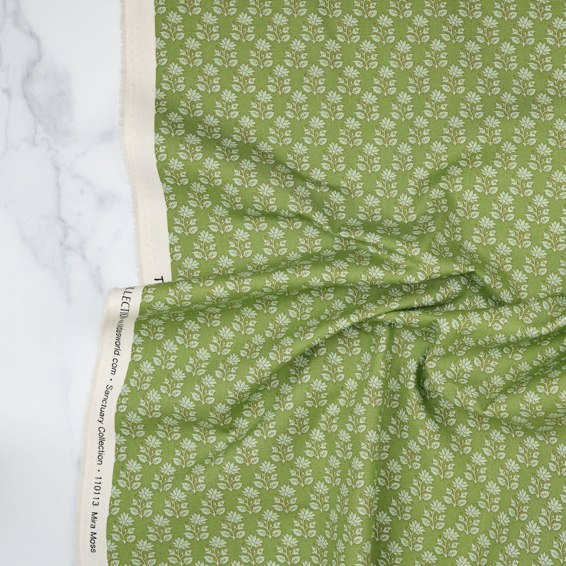 Cotton quilting fabric pattern called 'Mira Moss'. Part of the 'Sanctuary' fabric collection. Designed by Tone Finnanger for fabric company Tilda Fabrics. SKU: TIL110113. 44-45 inch width.