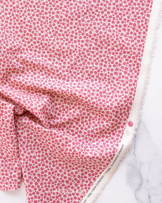 Cotton quilting fabric pattern called 'Eucalyptus in Hibiscus'. Part of the 'Hibernation' fabric collection. Designed by Tilda Fabrics for fabric company Tilda Fabrics. SKU: 110088. 44-45 inch width.
