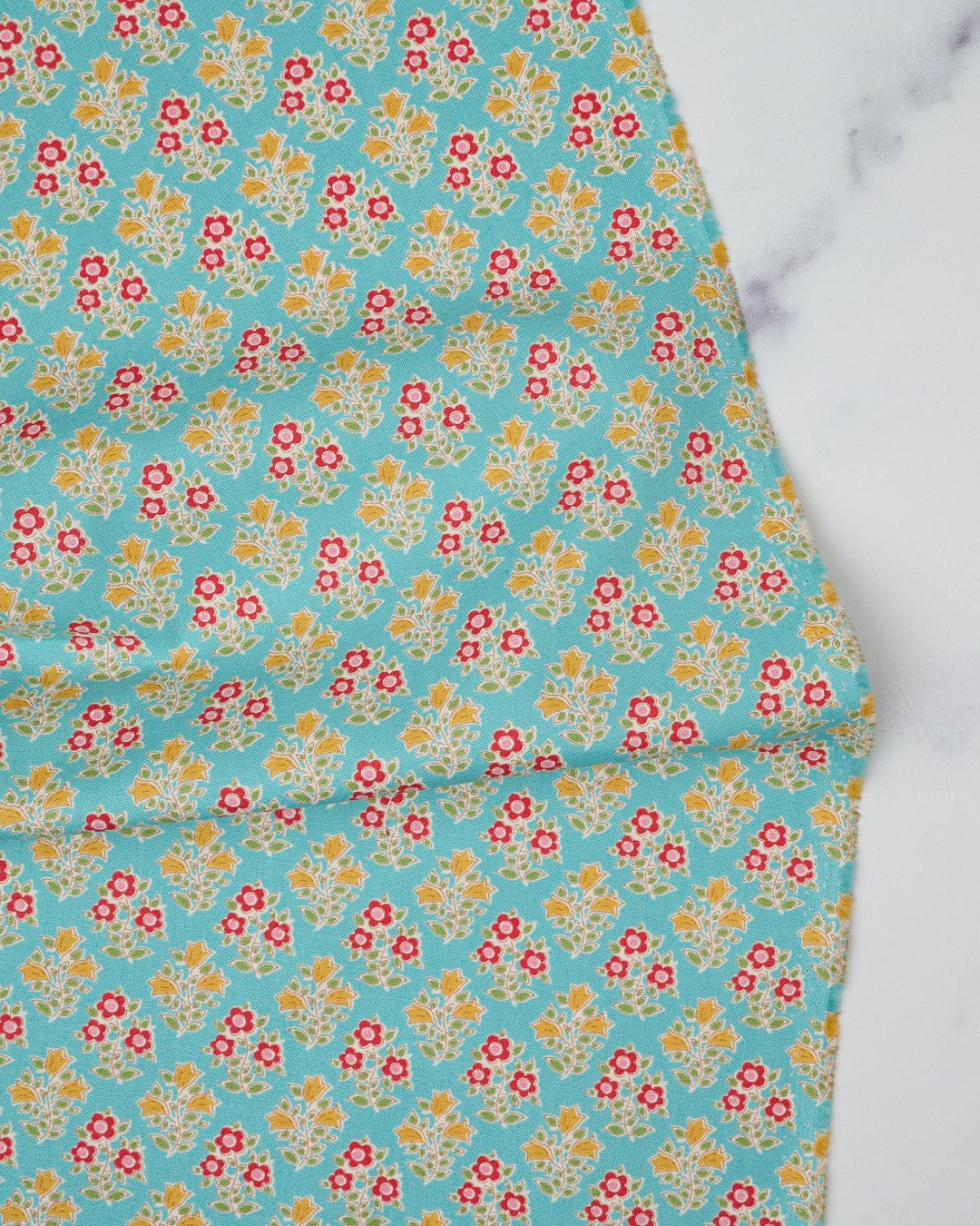 Cotton quilting fabric pattern called 'Farm Flowers in Teal'. Part of the 'Jubilee' fabric collection. Designed by Tilda Fabrics for fabric company Tilda Fabrics. SKU: 110103. 44-45 inch width.