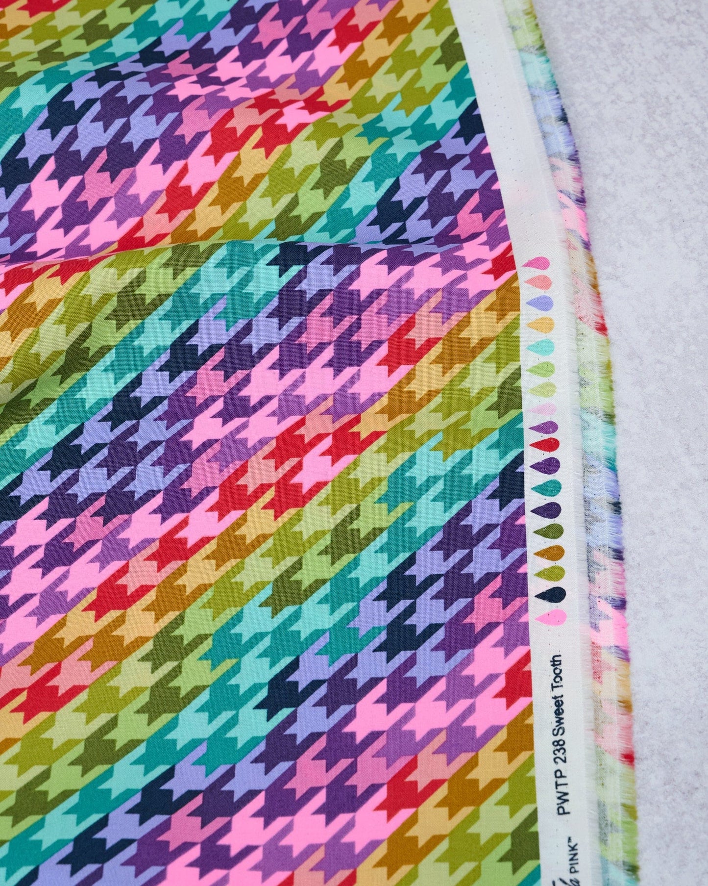 Cotton quilting fabric pattern called 'Sweet Tooth in Cosmic'. Part of the 'Untamed' fabric collection. Designed by Tula Pink for fabric company Free Spirit Fabrics. SKU: PWTP238.COSMIC. 44-45 inch width.