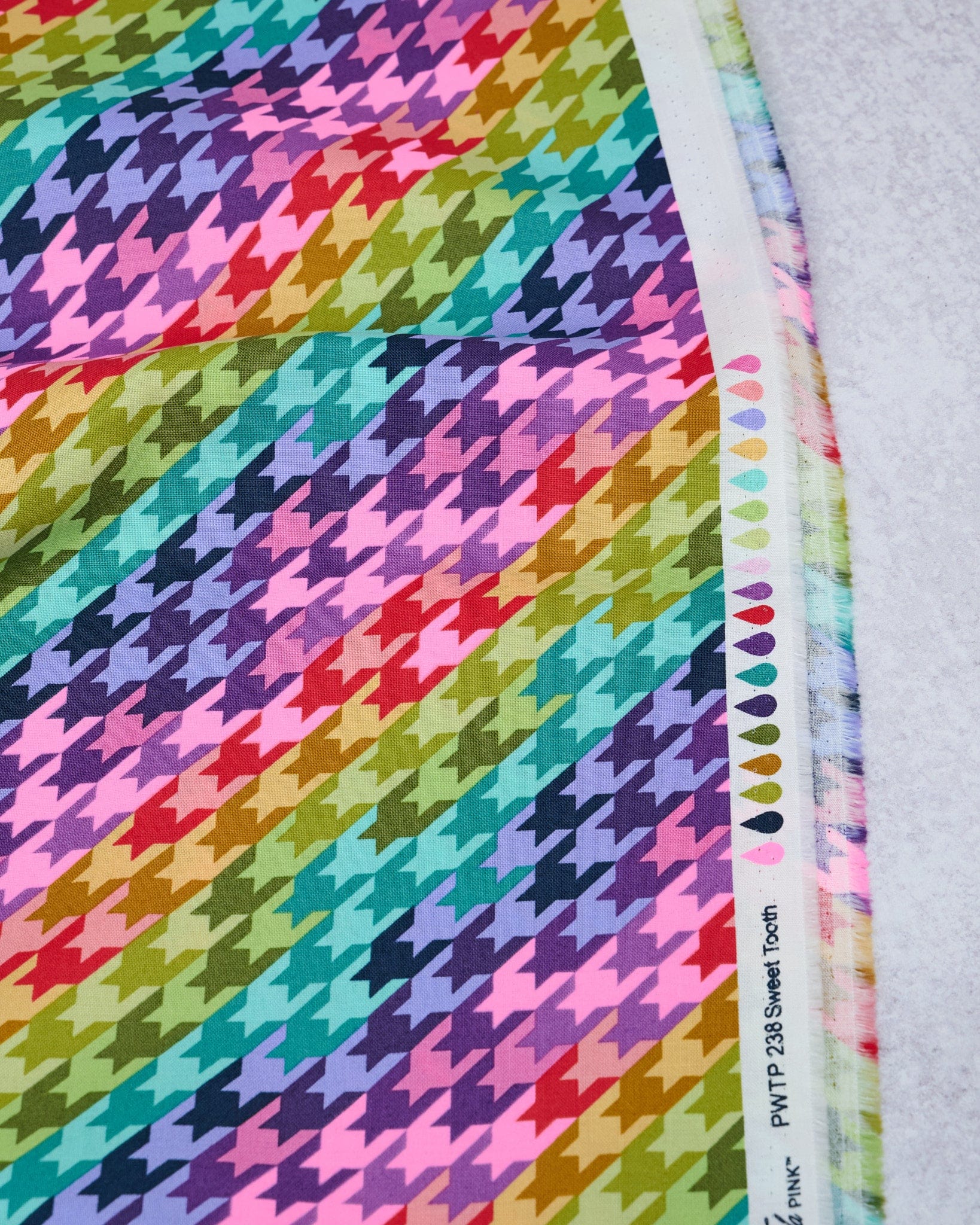 Cotton quilting fabric pattern called 'Sweet Tooth in Cosmic'. Part of the 'Untamed' fabric collection. Designed by Tula Pink for fabric company Free Spirit Fabrics. SKU: PWTP238.COSMIC. 44-45 inch width.