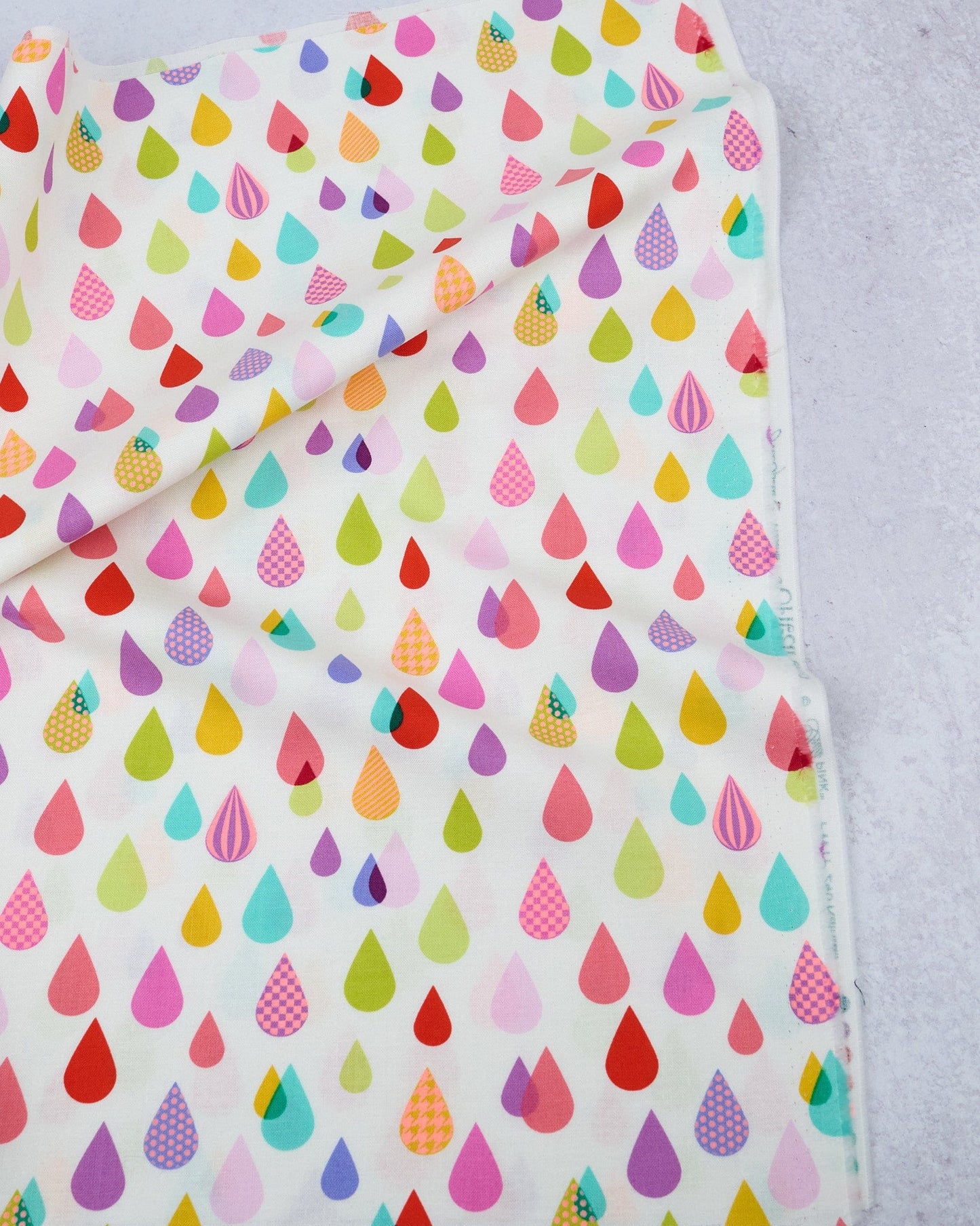 Cotton quilting fabric pattern called 'Rainfall in Lunar'. Part of the 'Untamed' fabric collection. Designed by Tula Pink for fabric company Free Spirit Fabrics. SKU: PWTP240.LUNAR. 44-45 inch width.