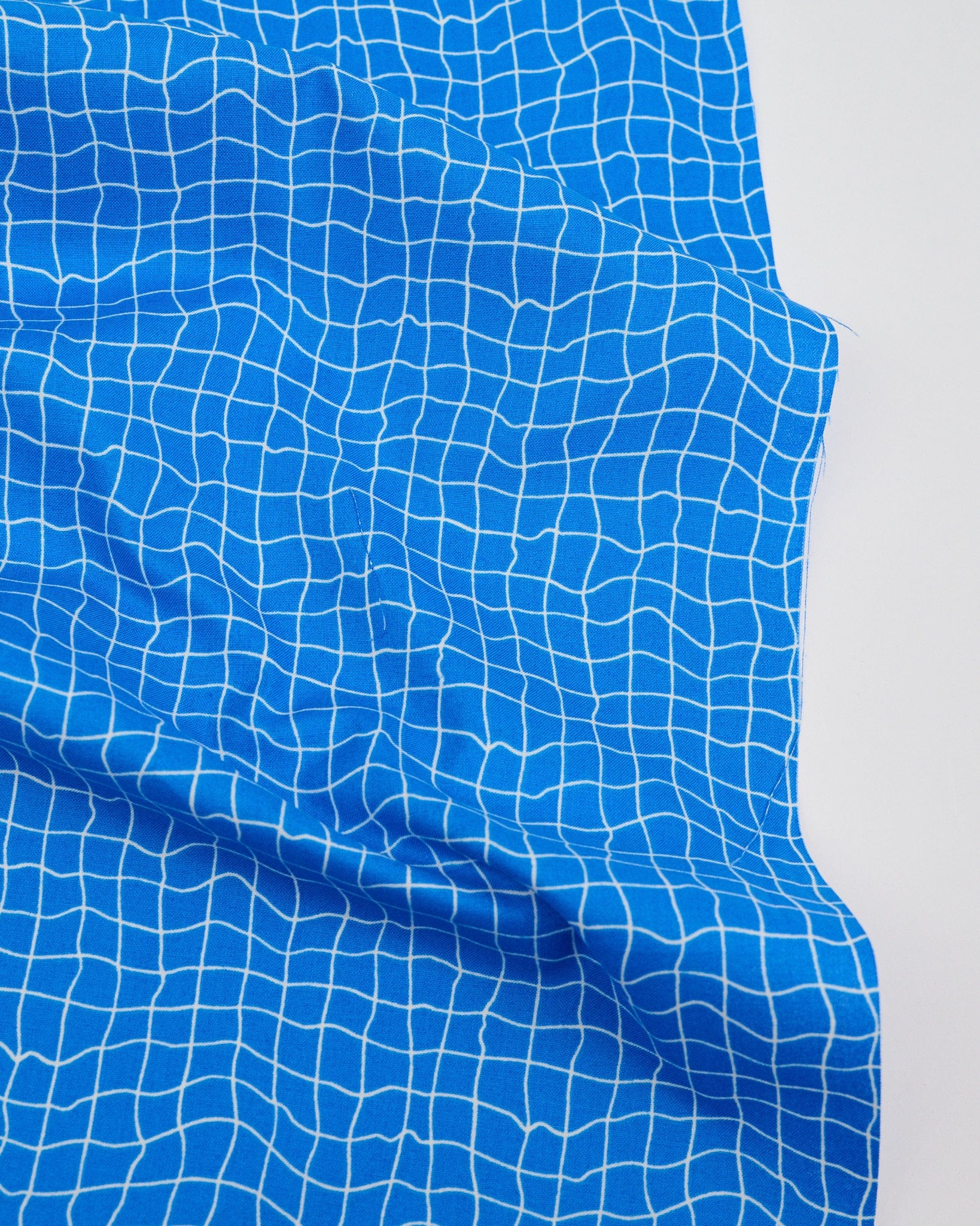 Cotton quilting fabric pattern called 'Water Pool Tiles in Royal Blue'. Part of the 'Water' fabric collection. Designed by Ruby Star Society for fabric company Moda Fabrics. SKU: RS5131 16. 44-45 inch width.