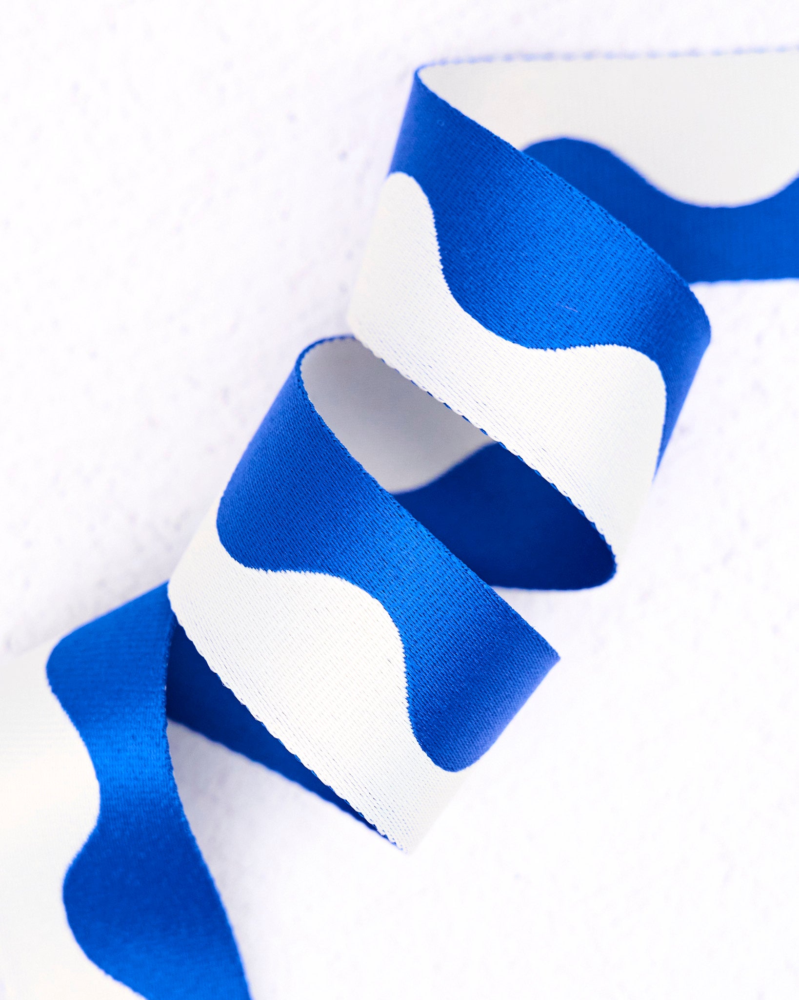Blue and white two-tone nylon wavy pattern webbing for bag making, straps and accessories, by Renaissance Ribbons