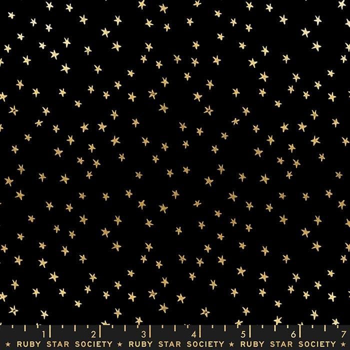 Cotton quilting fabric pattern called 'Mini Starry in Black Gold'. Part of the 'Starry' fabric collection. Designed by Ruby Star Society for fabric company Moda Fabrics. SKU: RS4110 27M. 44-45 inch width.