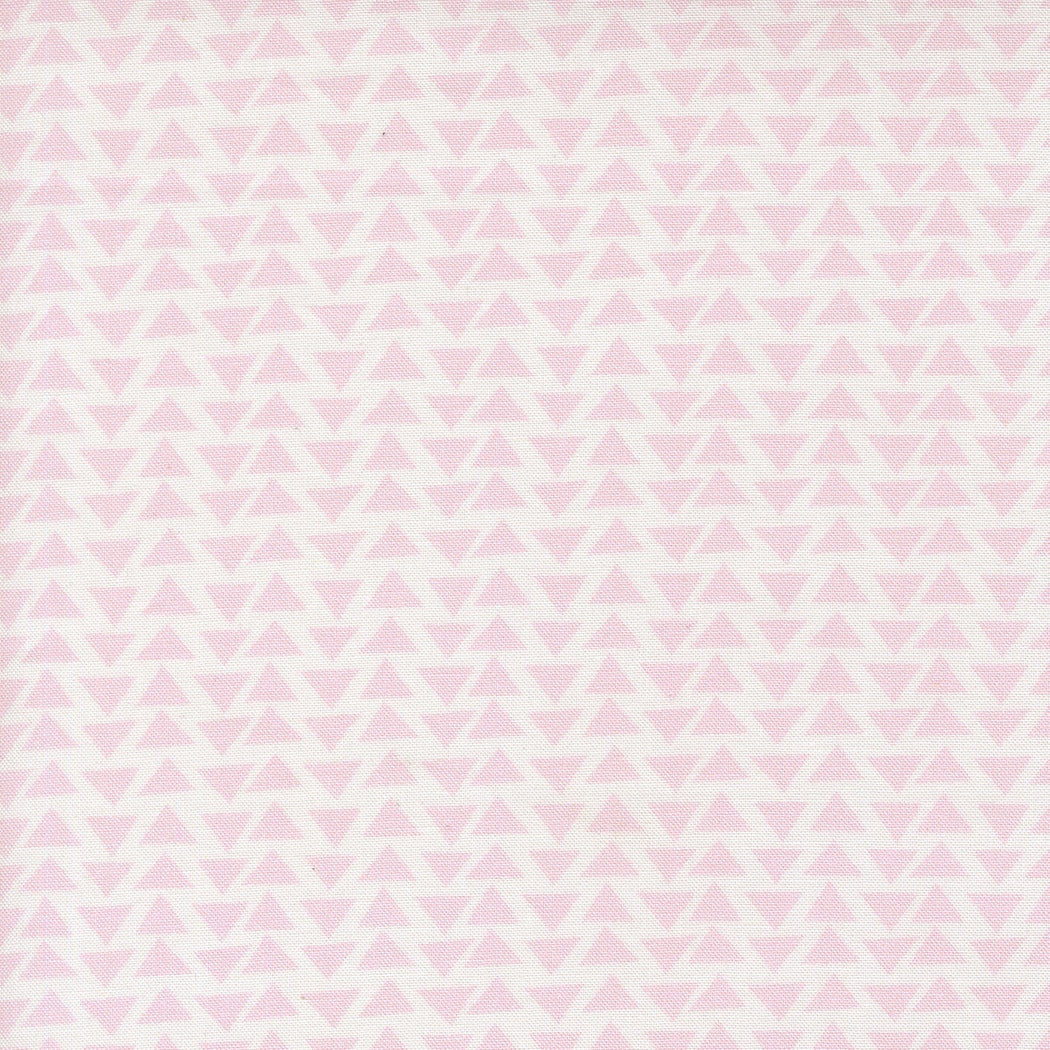 Pink geometric triangles on white allover cotton quilting fabric. Moda's Bonbon Jar by Jen Kingwell.