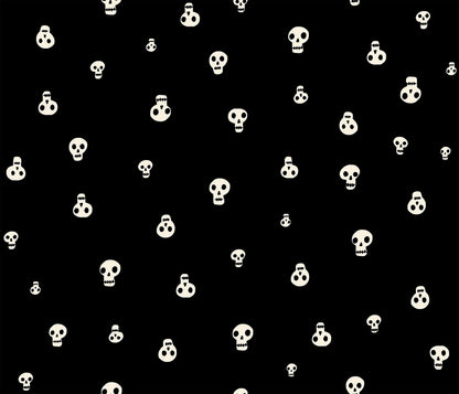 Moda's Halloween stylized cream skulls of varying sizes on black Boo Valley by Ruby Star Society's Alexia Abegg cotton quilting fabric